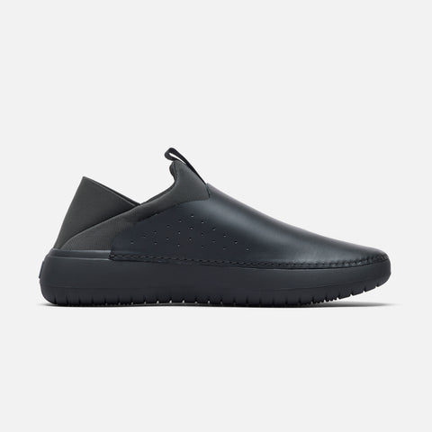 The Relaxed 2 medial side view showing smooth black slip-on chef shoe with perforations.