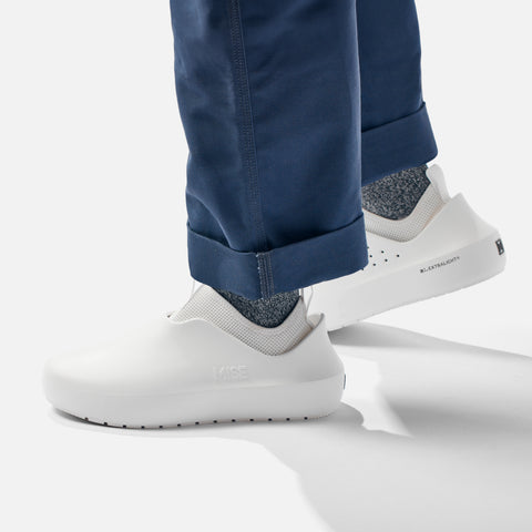 MISE All Day 2 white kitchen shoes on foot lateral view with heel exposing XL Extralight logo