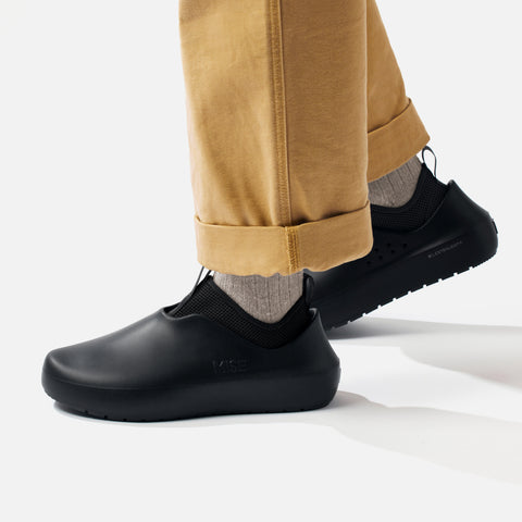 MISE All Day 2 black kitchen shoes on foot lateral view with heel exposing XL Extralight logo