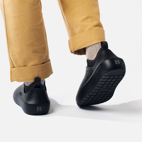 MISE All Day 2 black kitchen shoes on foot heel view with heel exposing XL Extralight logo