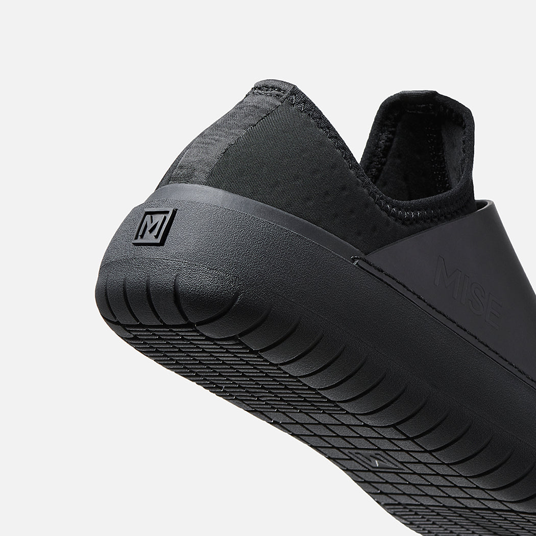 MISE Standard black non-slip kitchen shoe, angled back heel view